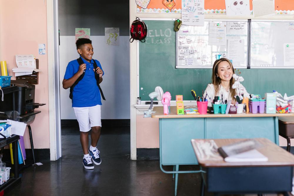 Student walking in to class Title 1