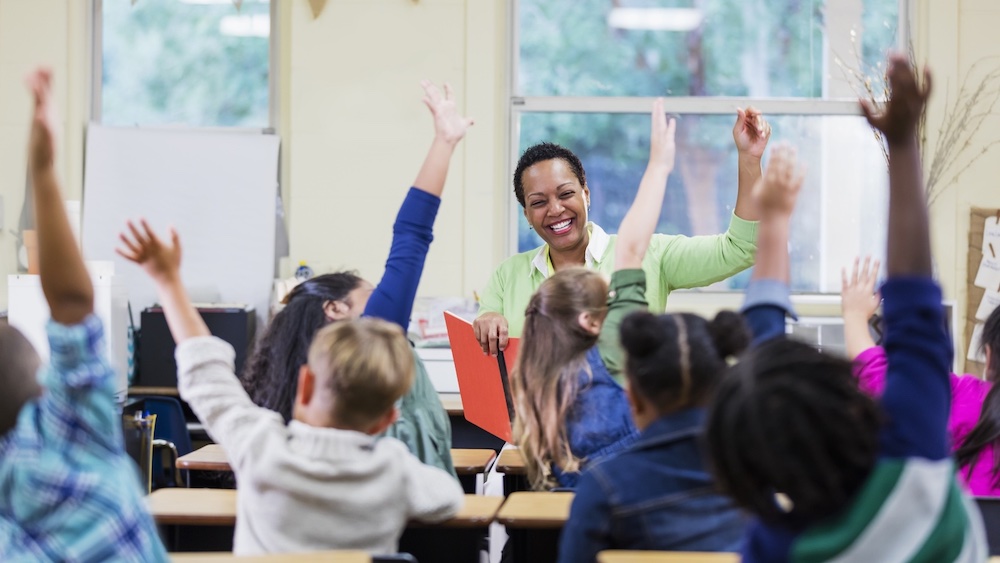 Kids raising hands
